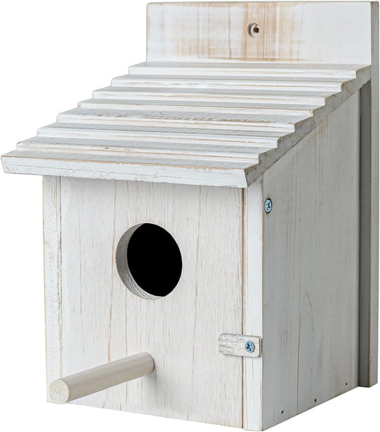 White wooden bird house with round entry hole, perch bar, and hinged door