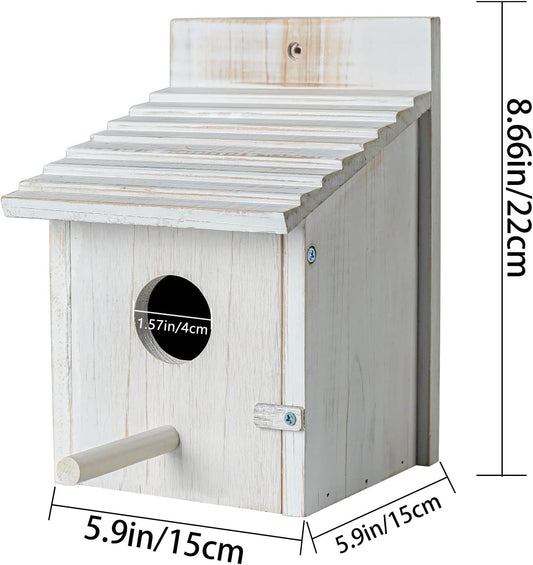 White wooden bird house with round entry hole, side perch, and metal latch