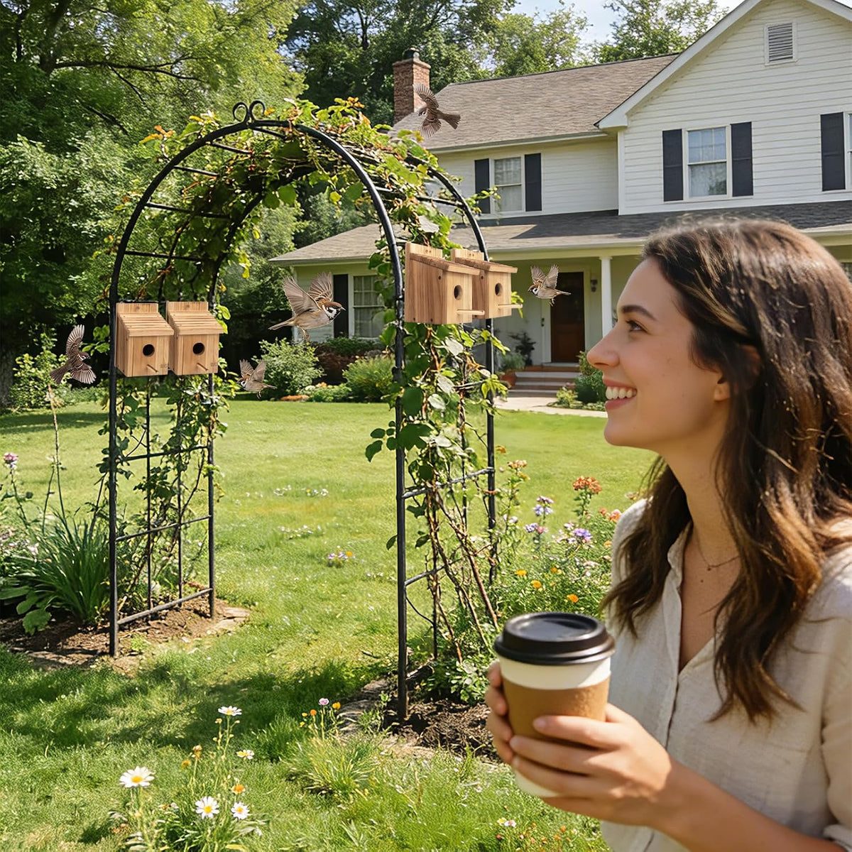 Wooden birdhouses in backyard garden on stands near a house