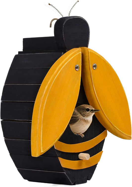 Bee-shaped wooden birdhouse with yellow wings open, black body, bird near entrance