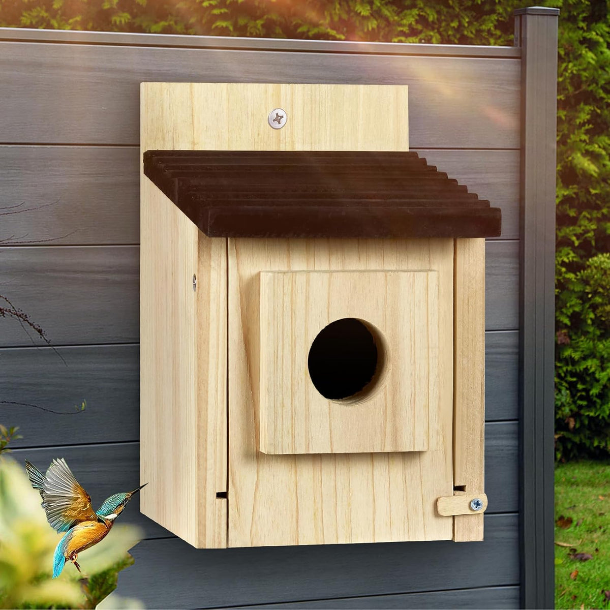 Wooden birdhouse with dark sloped roof, round entrance hole, hinged side clean-out door.