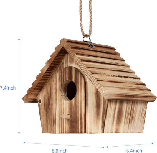 Wooden bird house with round entrance hole, small door, and rope hanging for size